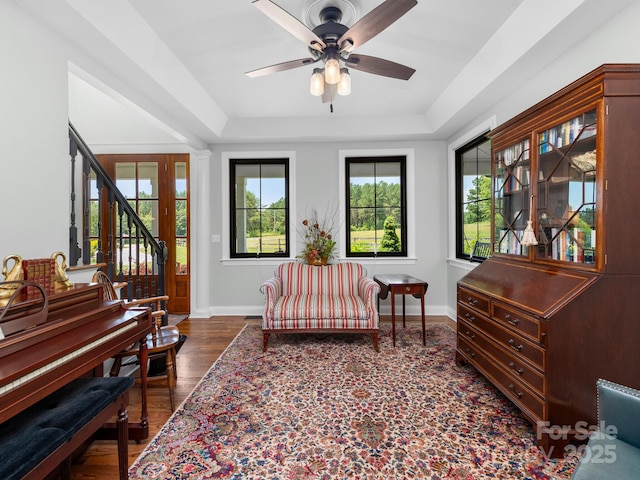 724 Moore Rd, Tryon, NC 28782 - living area featuring a raised ceiling, ceiling fan, stairway, and dark wood finished floors