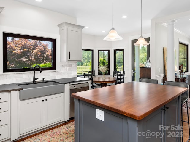 724 Moore Rd, Tryon, NC 28782 - kitchen with dishwasher, butcher block countertops, wood finished floors, recessed lighting, and backsplash