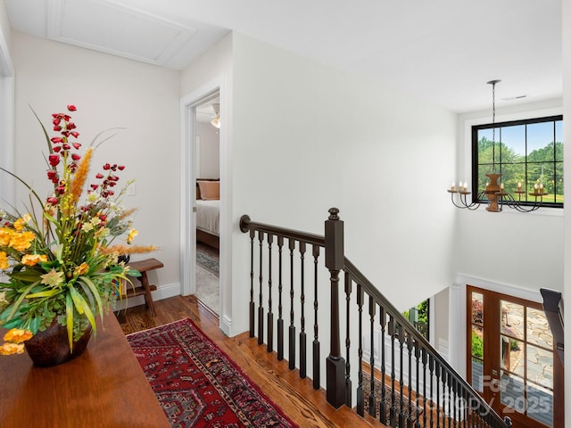 724 Moore Rd, Tryon, NC 28782 - corridor featuring an upstairs landing, wood finished floors, and a chandelier