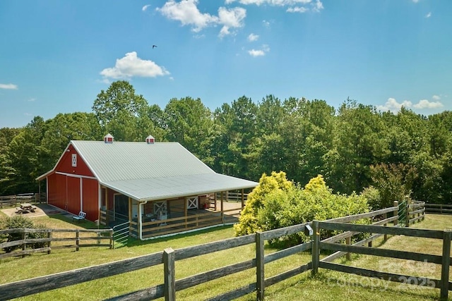 724 Moore Rd, Tryon, NC 28782 - horse barn featuring a view of trees