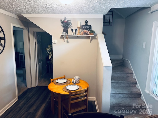 407 W Finger St, Maiden, NC 28650 - dining room featuring a textured ceiling, dark wood-type flooring, and stairway
