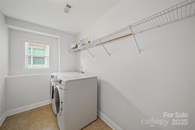 10420 Glenburn Ln, Charlotte, NC 28278 - laundry room with washer and dryer and light tile patterned floors