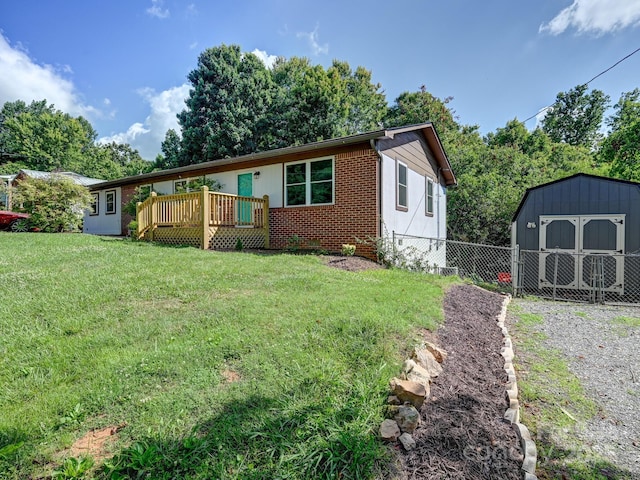 85 Pine Ridge Rd, Mars Hill, NC 28754 - ranch-style home with a storage shed, a wooden deck, and brick siding