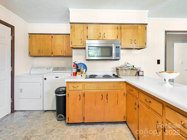 85 Pine Ridge Rd, Mars Hill, NC 28754 - kitchen with stainless steel microwave, washer and dryer, electric stovetop, a textured ceiling, and ornamental molding