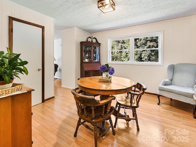 85 Pine Ridge Rd, Mars Hill, NC 28754 - dining area with a textured ceiling and light wood-style flooring
