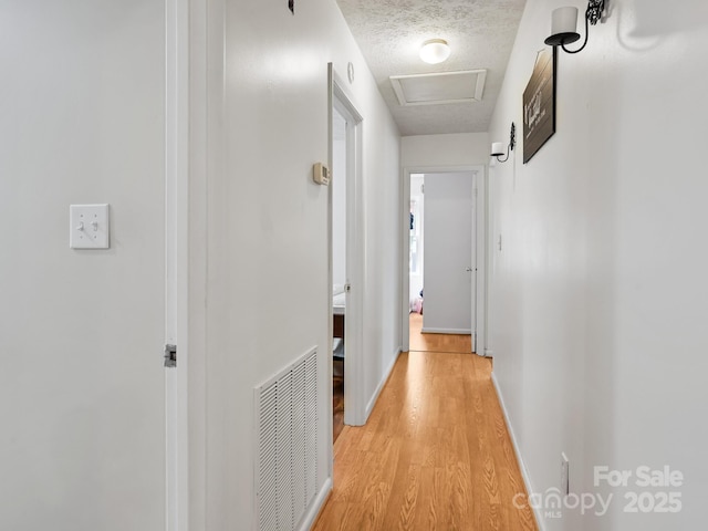 85 Pine Ridge Rd, Mars Hill, NC 28754 - hallway featuring light wood-style flooring and a textured ceiling