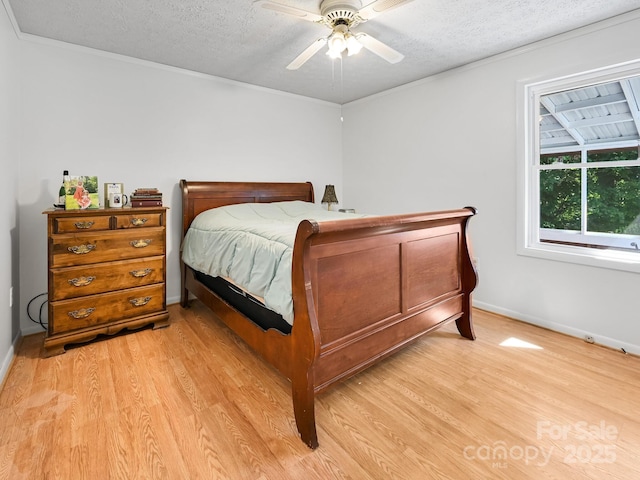 85 Pine Ridge Rd, Mars Hill, NC 28754 - bedroom with light wood-style floors, a textured ceiling, crown molding, and a ceiling fan