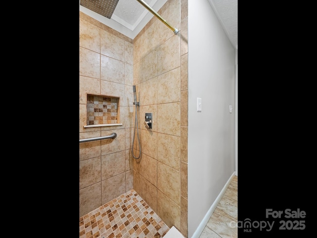 85 Pine Ridge Rd, Mars Hill, NC 28754 - bathroom featuring a tile shower and baseboards