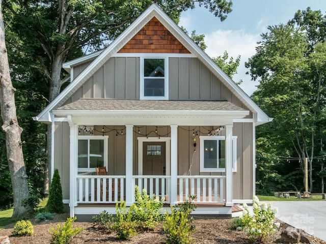 508 S Oconeechee Ave Unit 1, Black Mountain, NC 28711 - view of front of home with board and batten siding, a porch, and roof with shingles