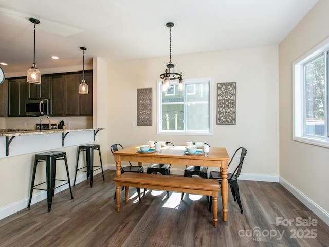 508 S Oconeechee Ave Unit 1, Black Mountain, NC 28711 - dining area with dark wood finished floors and a chandelier