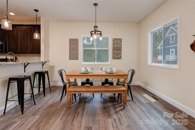 508 S Oconeechee Ave Unit 1, Black Mountain, NC 28711 - dining area with wood finished floors and a chandelier