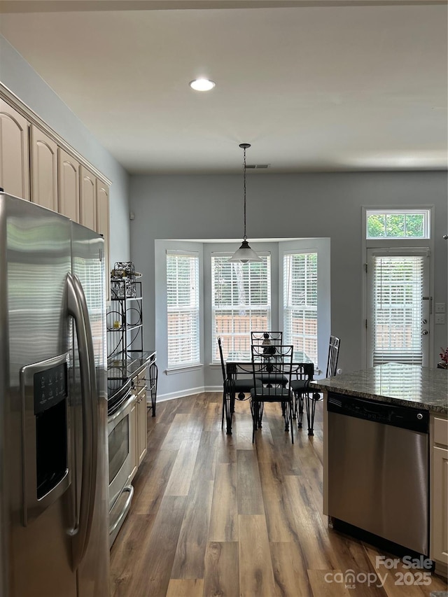 630 Springhouse Pl, Clover, SC 29710 - kitchen with stainless steel appliances, dark wood-type flooring, recessed lighting, pendant lighting, and dark stone countertops