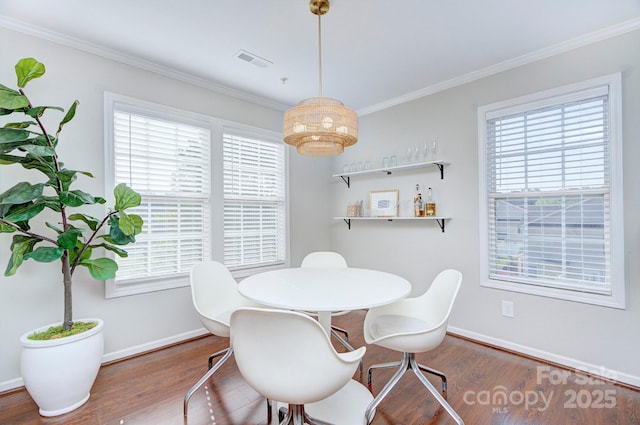 1075 Triece Ln, Charlotte, NC 28215 - dining room with wood finished floors, plenty of natural light, and crown molding