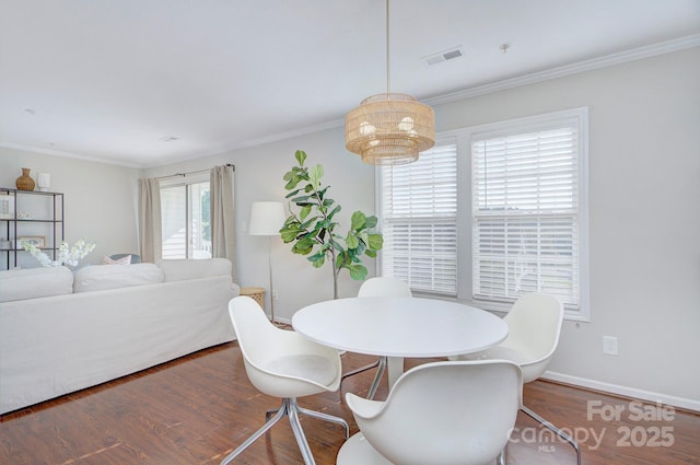 1075 Triece Ln, Charlotte, NC 28215 - dining room with wood finished floors and ornamental molding