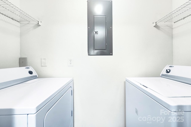 1075 Triece Ln, Charlotte, NC 28215 - laundry room with electric panel and washing machine and clothes dryer