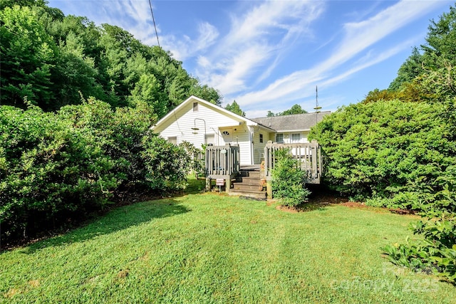 4720 Brevard Rd, Horse Shoe, NC 28742 - view of front of house featuring a front yard and a wooden deck