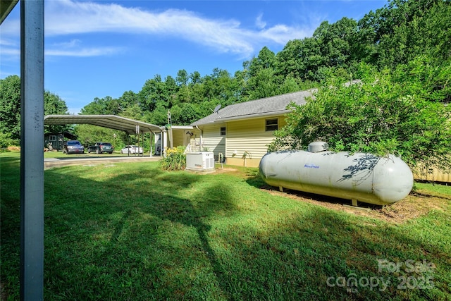 4720 Brevard Rd, Horse Shoe, NC 28742 - view of green lawn featuring a carport