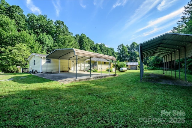 4720 Brevard Rd, Horse Shoe, NC 28742 - view of green lawn featuring a carport