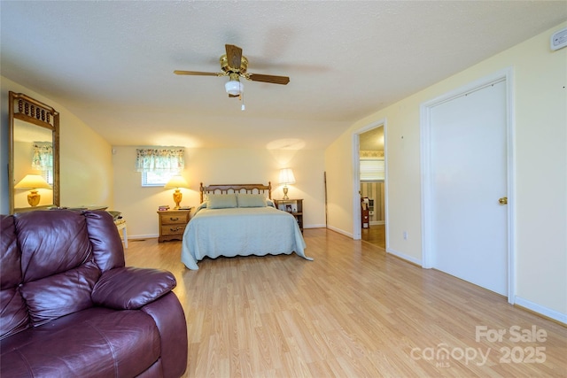 4720 Brevard Rd, Horse Shoe, NC 28742 - bedroom featuring light wood-style floors and ceiling fan