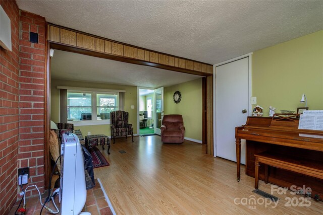 4720 Brevard Rd, Horse Shoe, NC 28742 - living room with a textured ceiling and wood finished floors