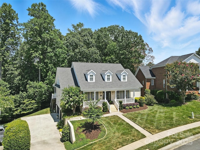 9012 Arrington Manor Pl, Charlotte, NC 28277 - new england style home with covered porch, driveway, a front yard, and roof with shingles