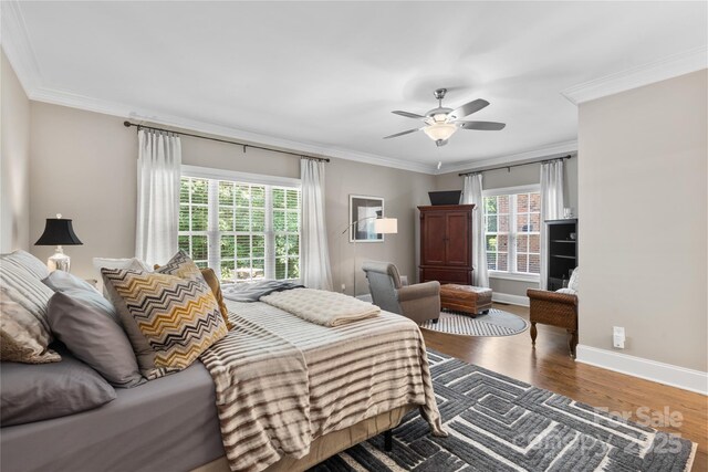 9012 Arrington Manor Pl, Charlotte, NC 28277 - bedroom featuring crown molding, wood finished floors, and a ceiling fan