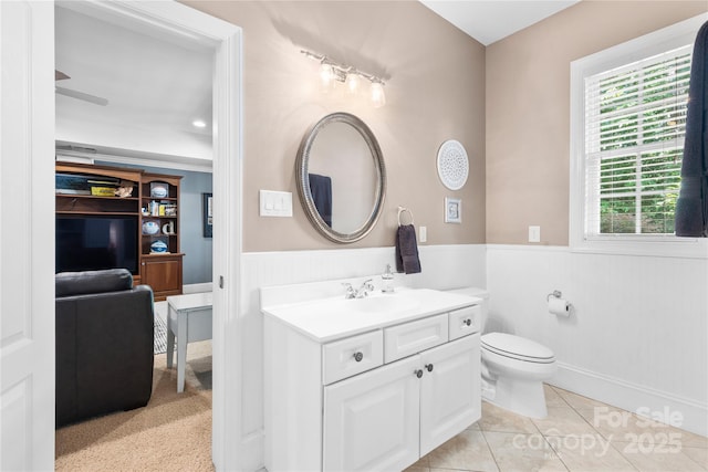 9012 Arrington Manor Pl, Charlotte, NC 28277 - bathroom featuring a wainscoted wall, vanity, and tile patterned floors