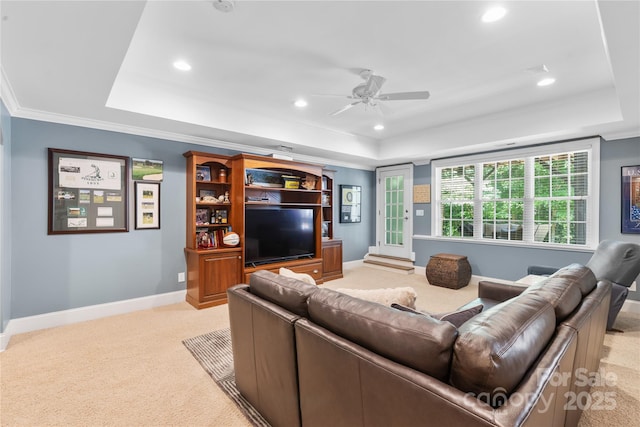 9012 Arrington Manor Pl, Charlotte, NC 28277 - living room featuring a raised ceiling, light carpet, a ceiling fan, recessed lighting, and crown molding