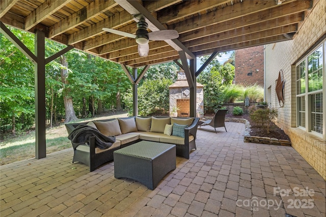 9012 Arrington Manor Pl, Charlotte, NC 28277 - view of patio / terrace with an outdoor living space with a fireplace and a ceiling fan