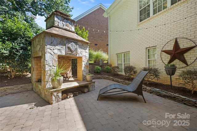 9012 Arrington Manor Pl, Charlotte, NC 28277 - view of patio with an outdoor stone fireplace