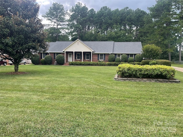 470 Roger Dr, Salisbury, NC 28147 - ranch-style house with a front lawn, brick siding, a shingled roof, and view of wooded area