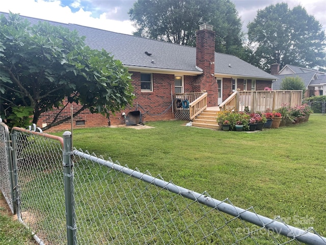 470 Roger Dr, Salisbury, NC 28147 - rear view of property featuring a fenced backyard, a wooden deck, brick siding, a chimney, and a shingled roof