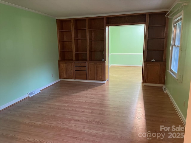 470 Roger Dr, Salisbury, NC 28147 - spare room with wood finished floors, built in shelves, plenty of natural light, and crown molding