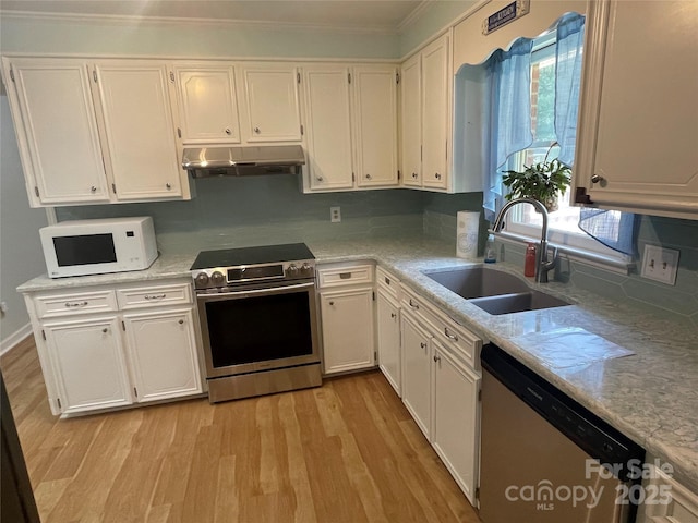 470 Roger Dr, Salisbury, NC 28147 - kitchen featuring stainless steel appliances, under cabinet range hood, white cabinetry, healthy amount of natural light, and crown molding