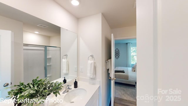 1053 20th Avenue Loop SE, Hickory, NC 28602 - ensuite bathroom with vanity, an enclosed shower, recessed lighting, and wood finished floors