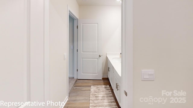 1053 20th Avenue Loop SE, Hickory, NC 28602 - bathroom with wood finished floors and vanity