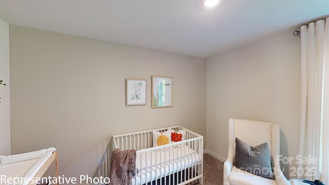 1053 20th Avenue Loop SE, Hickory, NC 28602 - bedroom with carpet flooring and a crib