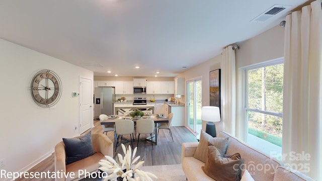 1053 20th Avenue Loop SE, Hickory, NC 28602 - living room featuring light wood-style flooring and recessed lighting