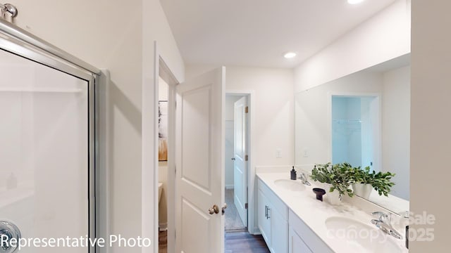 1053 20th Avenue Loop SE, Hickory, NC 28602 - full bath featuring double vanity, recessed lighting, a shower, and wood finished floors
