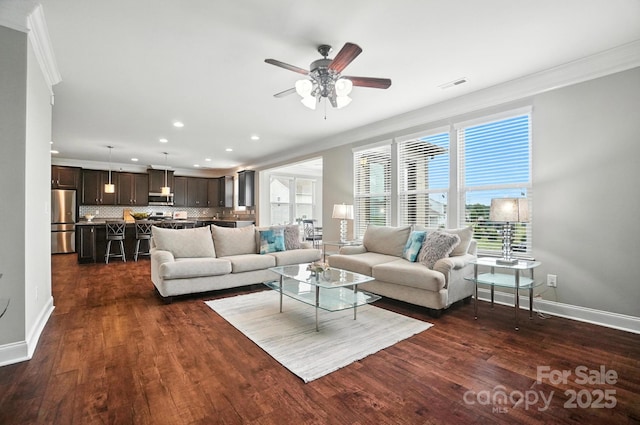 2006 Paddington Dr, Indian Trail, NC 28079 - living area with crown molding, recessed lighting, a ceiling fan, dark wood-style floors, and plenty of natural light