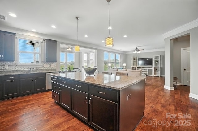 2006 Paddington Dr, Indian Trail, NC 28079 - kitchen with a ceiling fan, crown molding, a center island, dishwasher, and plenty of natural light