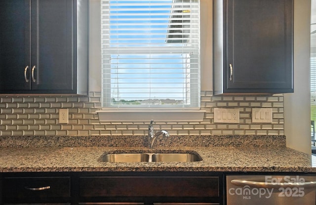 2006 Paddington Dr, Indian Trail, NC 28079 - kitchen featuring dishwasher, dark stone countertops, decorative backsplash, and plenty of natural light