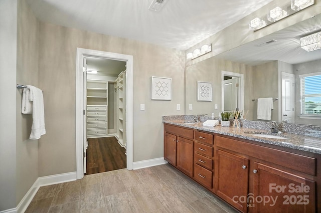 2006 Paddington Dr, Indian Trail, NC 28079 - bathroom featuring double vanity and a spacious closet