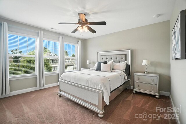 2006 Paddington Dr, Indian Trail, NC 28079 - bedroom with dark carpet and ceiling fan