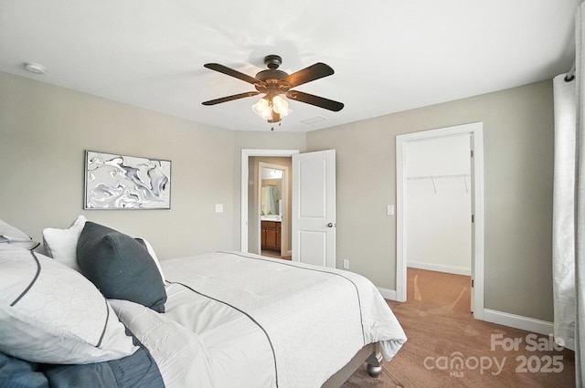 2006 Paddington Dr, Indian Trail, NC 28079 - bedroom with light colored carpet, a walk in closet, and ceiling fan