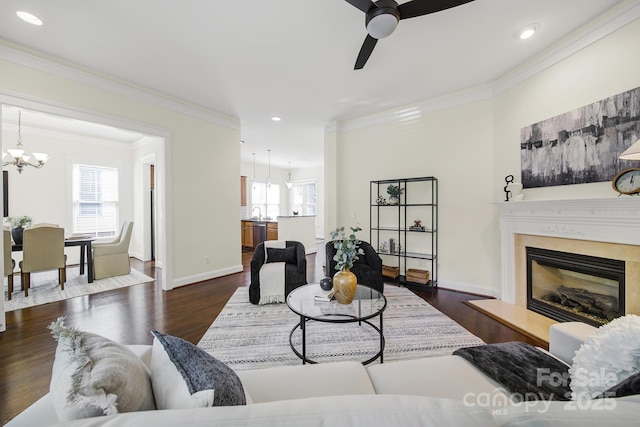 1855 Second Baxter Xing, Fort Mill, SC 29708 - living area with a chandelier, ceiling fan, healthy amount of natural light, crown molding, and a premium fireplace