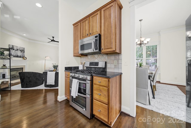 1855 Second Baxter Xing, Fort Mill, SC 29708 - kitchen with stainless steel appliances, crown molding, a chandelier, dark wood-style floors, and backsplash