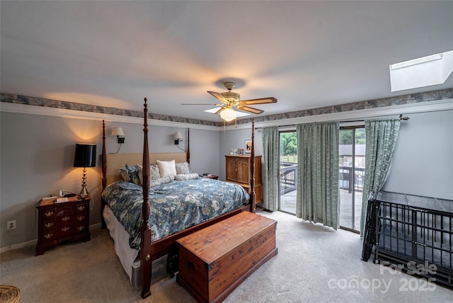 7411 Davis Rd, Waxhaw, NC 28173 - bedroom with access to exterior, carpet flooring, ceiling fan, and a skylight