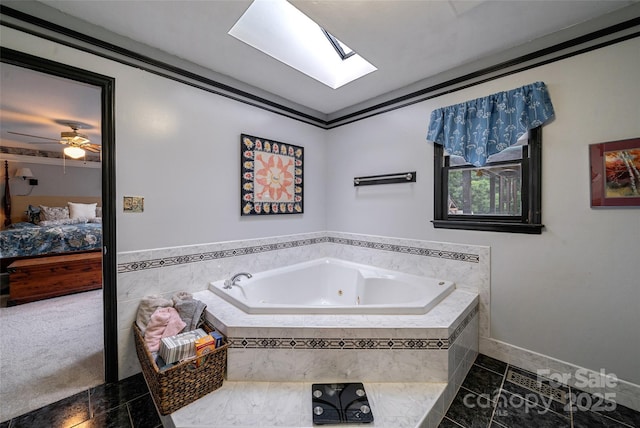 7411 Davis Rd, Waxhaw, NC 28173 - bathroom featuring ensuite bathroom, a whirlpool tub, a skylight, and ceiling fan