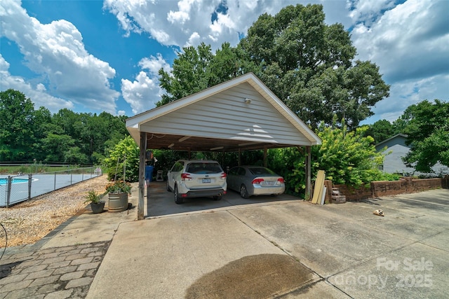 7411 Davis Rd, Waxhaw, NC 28173 - view of parking featuring concrete driveway and a carport